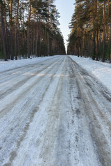 Road in Russia forest with covered snow. Winter time. Landscape.