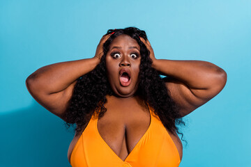 Photo of worried confident figure lady hear tourist border closed hands head scream wear bikini isolated on blue color background