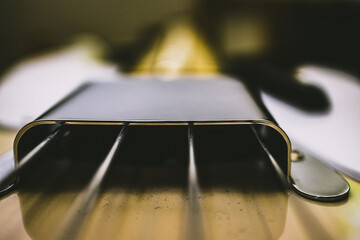 Closeup shot of a bass guitar strings against a blurred background
