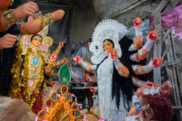 Kolkata, West Bengal, India - 7th October 2018 : Clay idol face of Goddess Durga, with white dress...