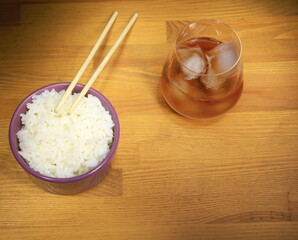 Rice in a cup, healthy food, Asian cuisine, glass of whiskey with ice.