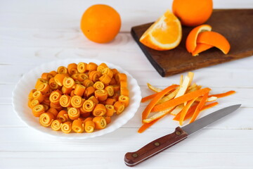 orange peel in curls on a string in a plate. Homemade orange jam. Step 4. Step by step instructions