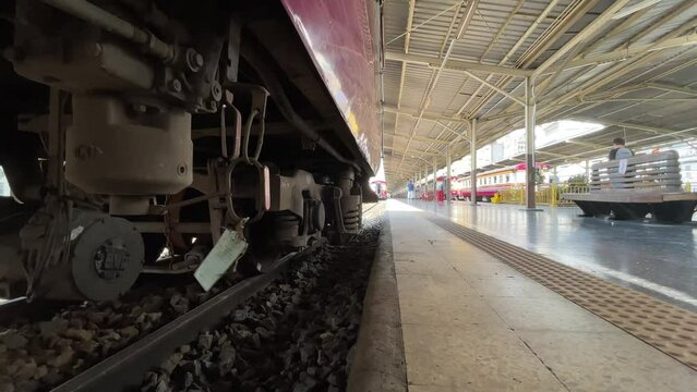 BANGKOK, THAILAND - Circa November, 2021: Parked train bogie low angle view at Hua Lamphong Railway Station, historical landmark well known as tourist attraction on a sunny day 