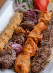 Arabic traditional food kufta and lamb brochette on the plate