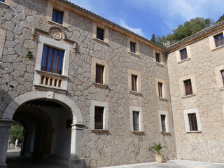 Fototapeta na wymiar Buildings around the courtyard of the LLuc Sanctuary, Mallorca, Balearic Islands, Spain