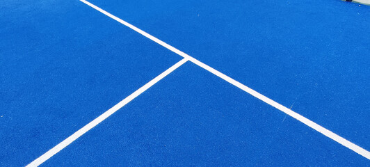 Closeup photo of the floor of a tennis court - Powered by Adobe