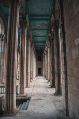 Vertical shot of old columns of Sanatorium Medea