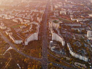 Aerial drone view of Chisinau, Moldova. The Gates of City, road with many cars and trees along it...