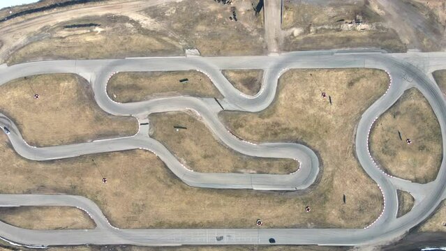 Aerial drone view Racing cars driving on winding race track. Aerial drone view. Motorsport competitions