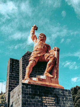 Statue of El Pipila in Guanajuato against a cloudy sky