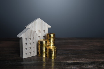 Apartment buildings and money coins. Profit from investment in real estate. Maintenance and repair....