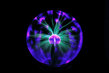 Decorative lamp in the shape of a plasma ball with red and blue tesla electrodes