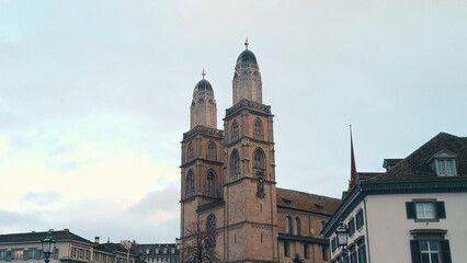 Scenic view of a church and buildings in historical city center of Zurich under a clear sky