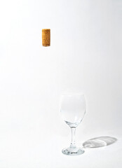 abstract concept of invisible bottle of white wine with glass on grey background. minimal composition.