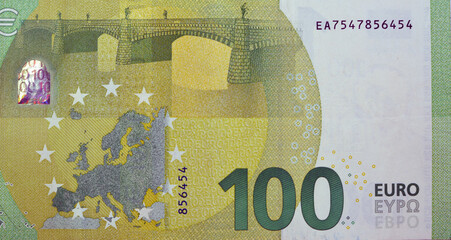 large fragment of the reverse side of €100 one hundred Euro bill banknote, the currency of the...