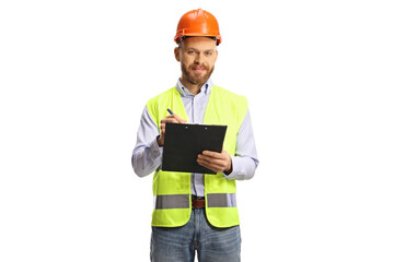 Male engineer with a safety vest and hardhat writing a on a clipboard and looking at camera
