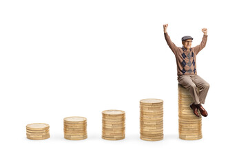 Happy elderly man seated on rising piles of coins