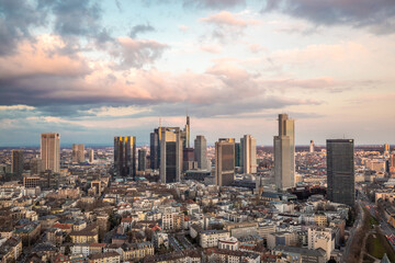 Skyline Frankfurt from above during an atmospheric, colorful sunrise. Cityscape in Germany with skyscrapers. city, Sunset - obrazy, fototapety, plakaty
