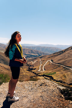 Woman looking to Cuesta de Lipan