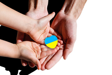 Family hands holding a heart in ucrainian colours. Peace and no war concept.