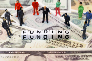 crowd of people and letter cube on dollar background. conceptual image for funding, investment and financial.