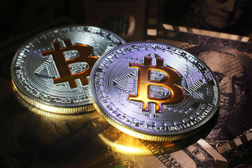 Bitcoin on dollar background, conceptual image for crypto currency.
