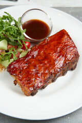 Closeup of pork ribs grilled with BBQ