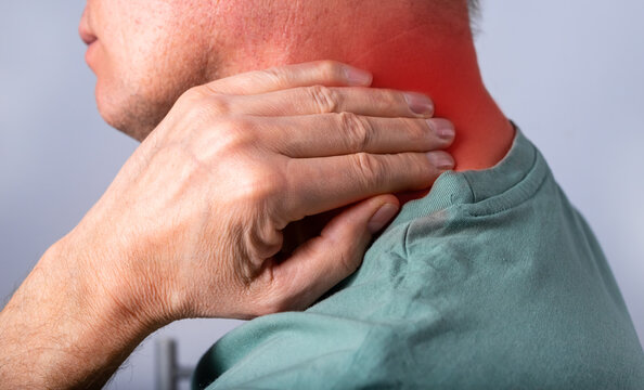 Neck pain closeup. Abstarct man suffering from injury, strain, discomfort. High quality photo