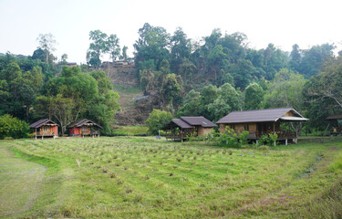 Fototapeta na wymiar Asian style small wooden house in the valley. Little wooden hut in the countryside in northern Thailand.