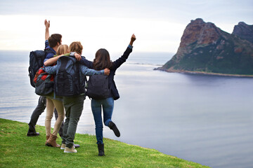 Holiday fun and excitement. A group of young people admiring the view together.