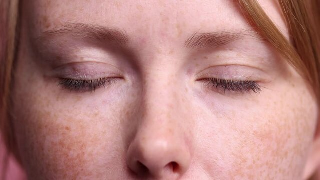 Close-up eyes of young multi ethnic people closing and opneing eyes. Concept of beauty, diversity, youth, art. 4k