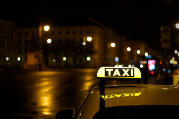 Closeup of a taxi sign on a car