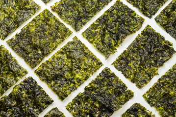 Tasty nori seaweed isolated on white. © Nikolay
