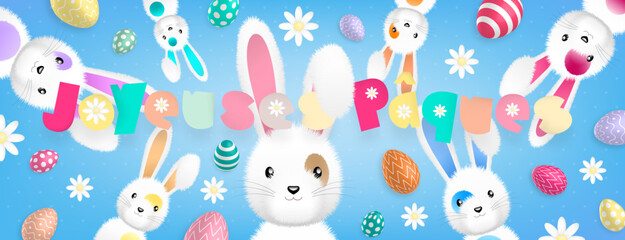 Texte «Joyeuses Pâques» aux couleurs pastels et de nombreux lapins dispersés autour accompagnés d’oeufs colorés et de fleurs sur un fond bleu
