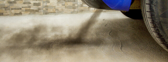 Car exhaust fumes to represent environmental pollution. Horizontal banner 