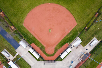 Aerial view of a baseball field with other surrounding fields and benches around