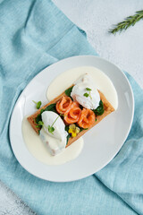 Waffles with soft cheese, red fish.