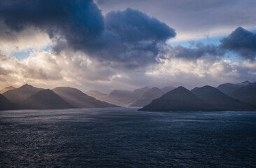 Europe, Faroe Islands, View from Kallur lighthouse off the cliffs on the northern end of the islands Eysteroy and Streymoy. November 2021