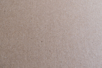 Fototapeta na wymiar detalle de textura de cartón limpio café con un doblez marcado ligeramente