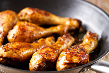 Fried Chicken Drumsticks with Herbs in a Pan