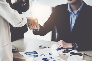 Business partnership meeting concept. Image business women handshake. Successful business people handshaking after good deal. Group support concept.