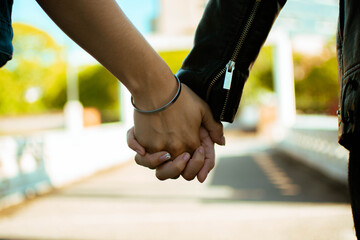 Closeup shot of a loving lesbian couple holding hands