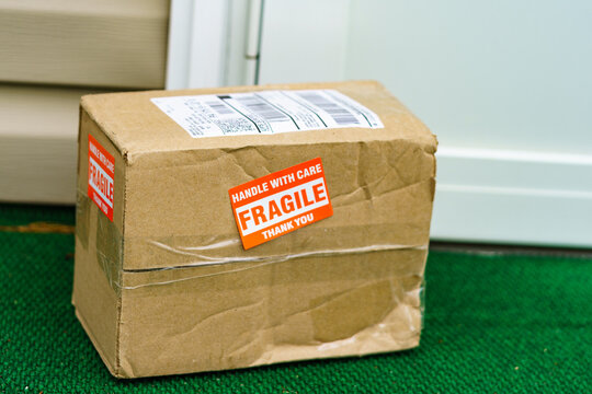 Home delivery package with Fragile sticker.