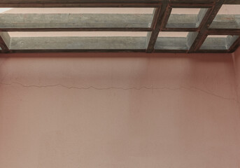 Minimal boho style. Wooden beams on the building in the Arabian style. Summer sunlight and shadows.