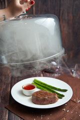Grilled asparagus with hollandaise sauce and steak