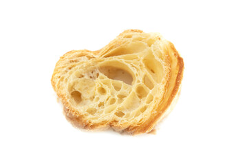 Pieces of dry croissant on a white background.