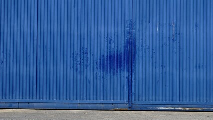 worn industrial blue metal door
