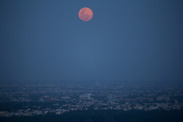 Red full moon over Mangalore