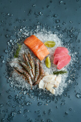 Fresh fish and seafood arrangement on crushed ice on a wooden table