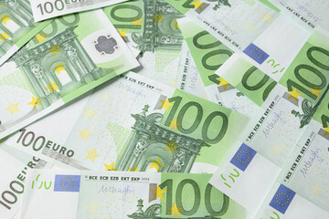 Obraz na płótnie Canvas European money in banknotes of 100 euros. Economic collapse. View from above.